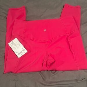 NWT Athleta Salutation Stash 7/8 Tight Leggings with Side Pockets L Tulip Pink